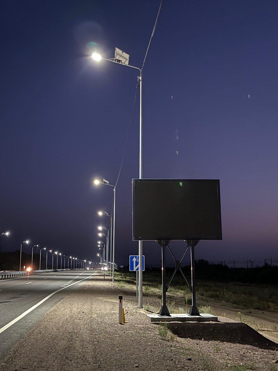 Night road with RAYERTECH roadside LED sign and lighting